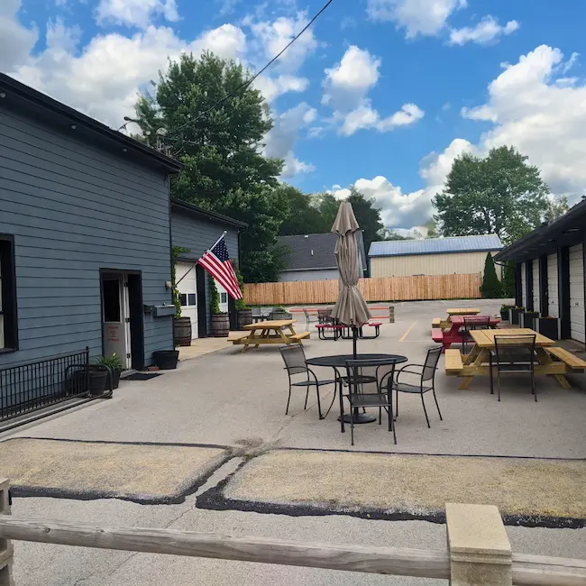 Outdoor patio seating at local brewery called Brewing Green.